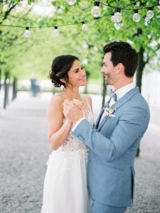 couple getting married in a german wedding castle, with a dusty blue color palette and velvet accessoires