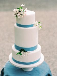 castle wedding in germany, white wedding cake with dusty blue color details