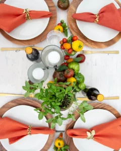 Golden cutlery and herb napkin rings at a stylish Italian party