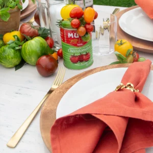Teak placemats and gold cutlery at an Italian party