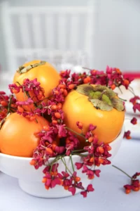 Natural decoration with persimmons and berries
