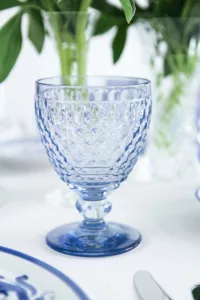 Close-up of the Villeroy & Boch Boston blue white wine glass on a festively laid table.