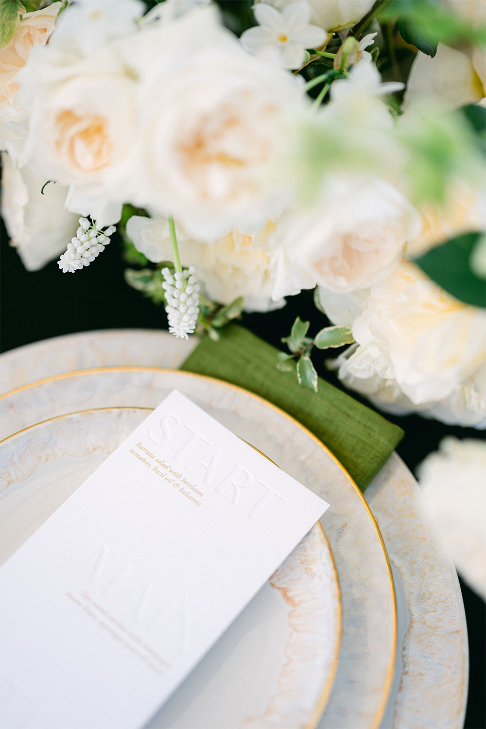 Reference Masterclass menu card, arranged with floral details and Taormina porcelain from the La Mer du Soir collection.