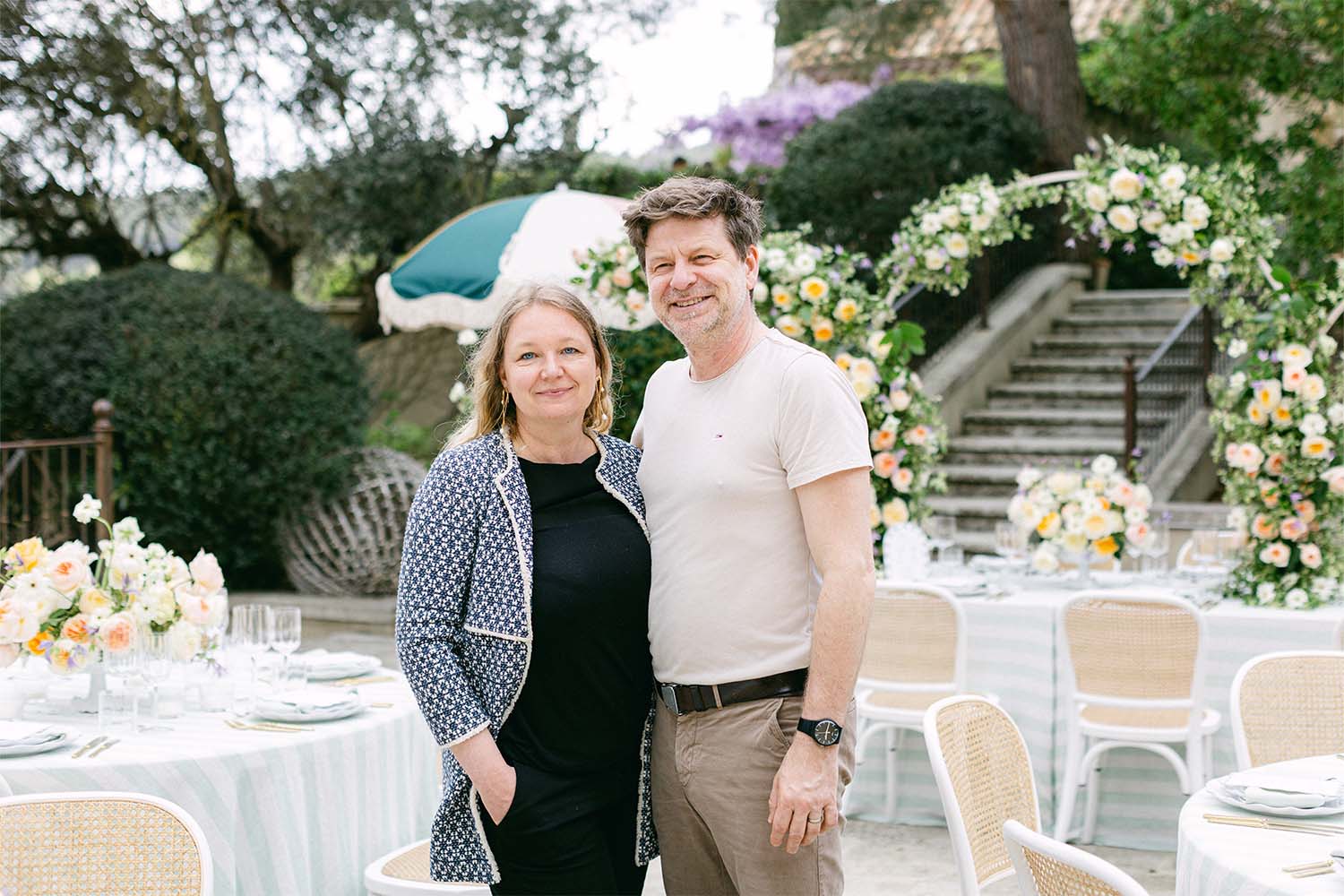 Irka and Marcell from Magnolias on Silk in front of floral arches in the event setting