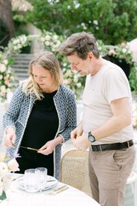 Irka and Marcell align the gold-coloured cutlery for the Reference Masterclass tabletop design.